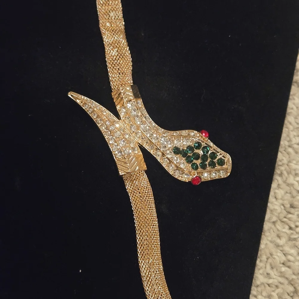 Elegant Gold Snake Bracelet with Green and Red Accents